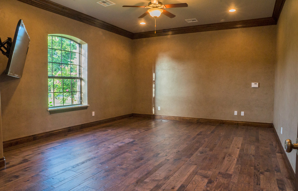 Large elegant dark wood floor multiuse home gym photo in Oklahoma City with beige walls