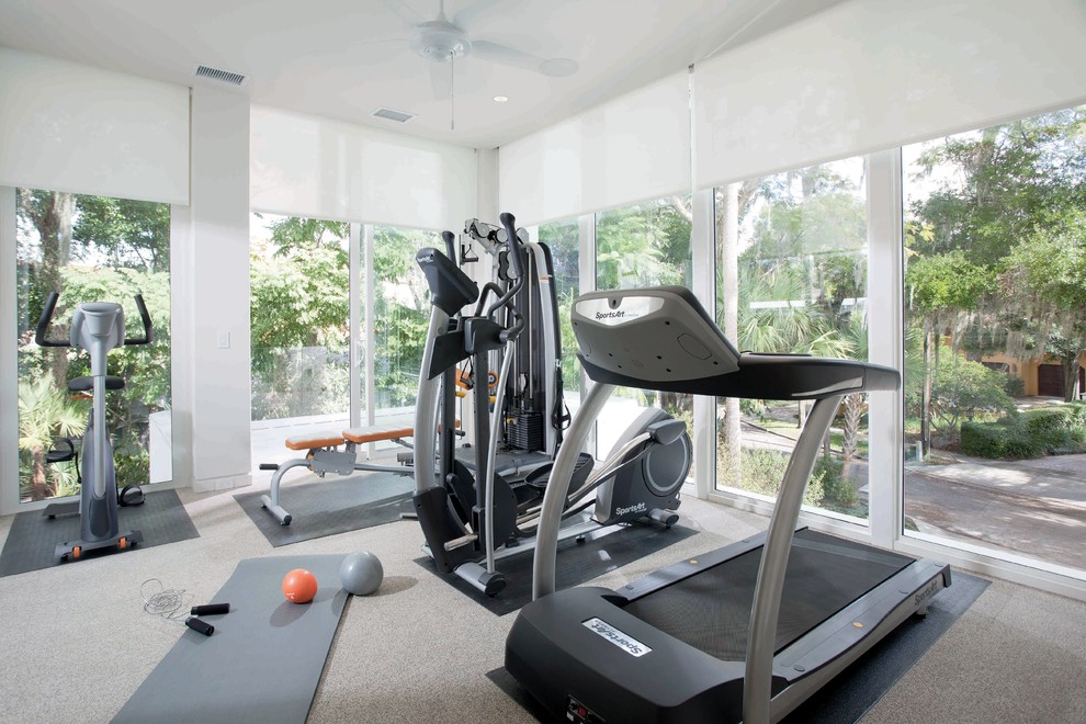 Design ideas for a large contemporary home weight room in Orlando with white walls.