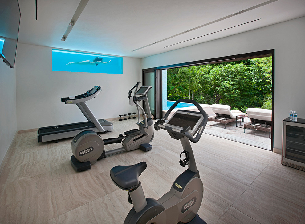 This is an example of a medium sized contemporary multi-use home gym in Other with white walls.