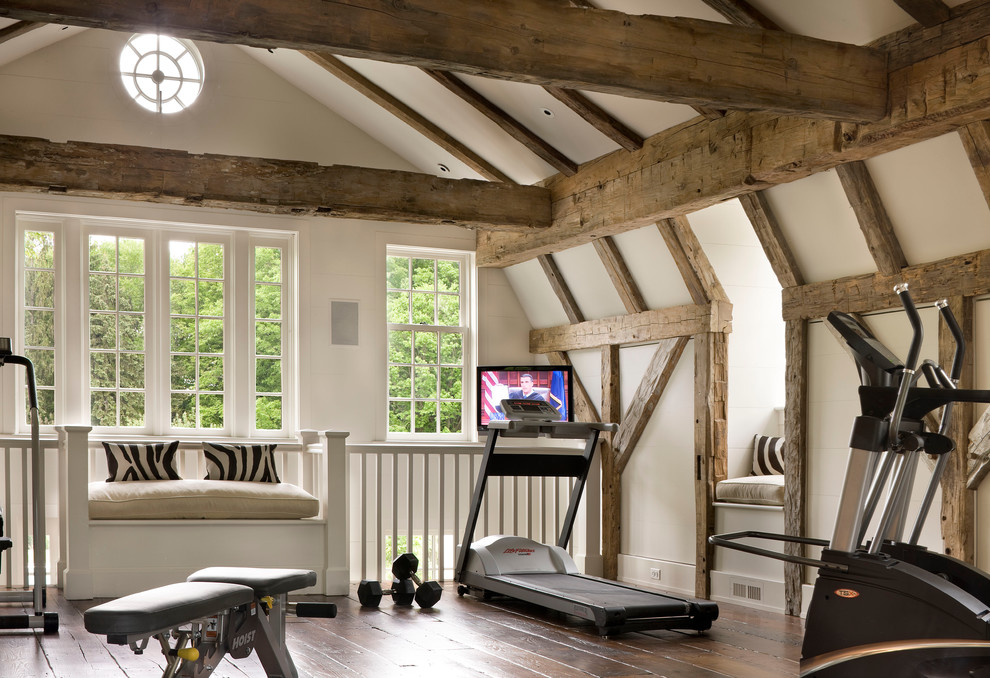 Inspiration for a large classic multi-use home gym in New York with white walls and dark hardwood flooring.