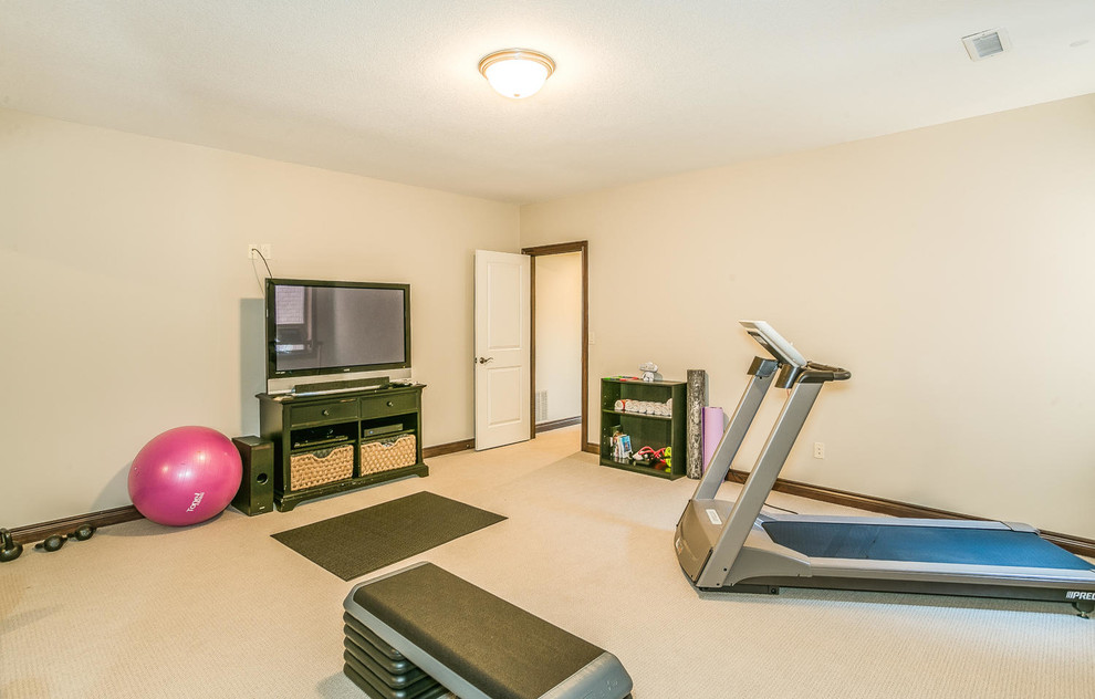 Multiuse home gym - mid-sized transitional carpeted and beige floor multiuse home gym idea in Wichita with beige walls