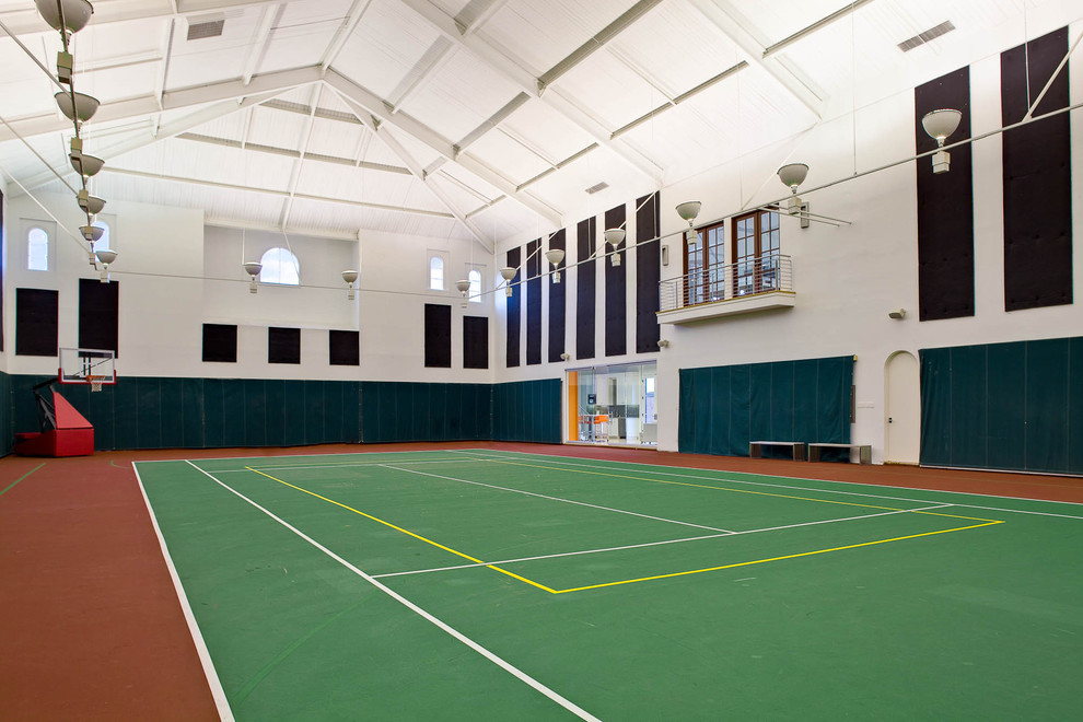 This is an example of an expansive mediterranean indoor sports court in Dallas with white walls.