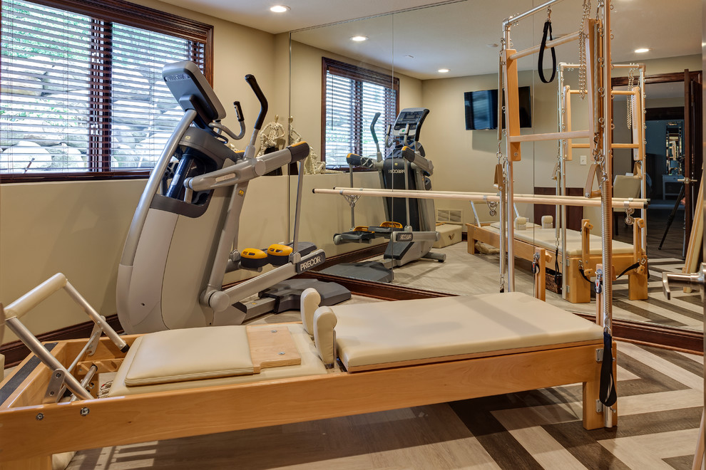 Photo of a medium sized contemporary multi-use home gym in Minneapolis with beige walls and vinyl flooring.