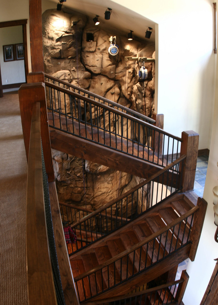 Design ideas for an expansive rustic home climbing wall in Denver with beige walls.