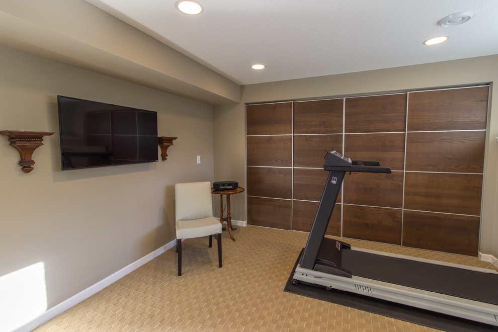 Photo of a classic multi-use home gym in Minneapolis with beige walls, carpet, beige floors and a feature wall.