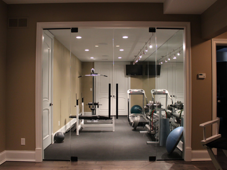 This is an example of a small traditional home weight room in Orange County with beige walls.