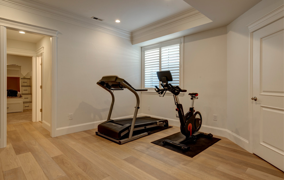 Design ideas for a small retro multi-use home gym in Denver with beige walls, laminate floors and multi-coloured floors.