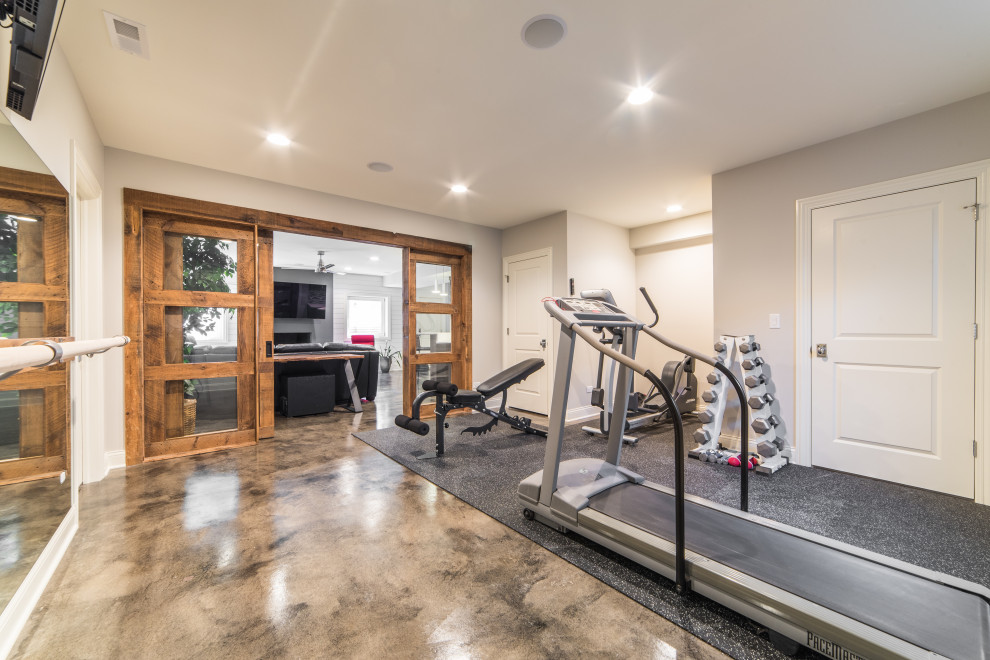 Multiuse home gym - mid-sized eclectic concrete floor and multicolored floor multiuse home gym idea in Chicago