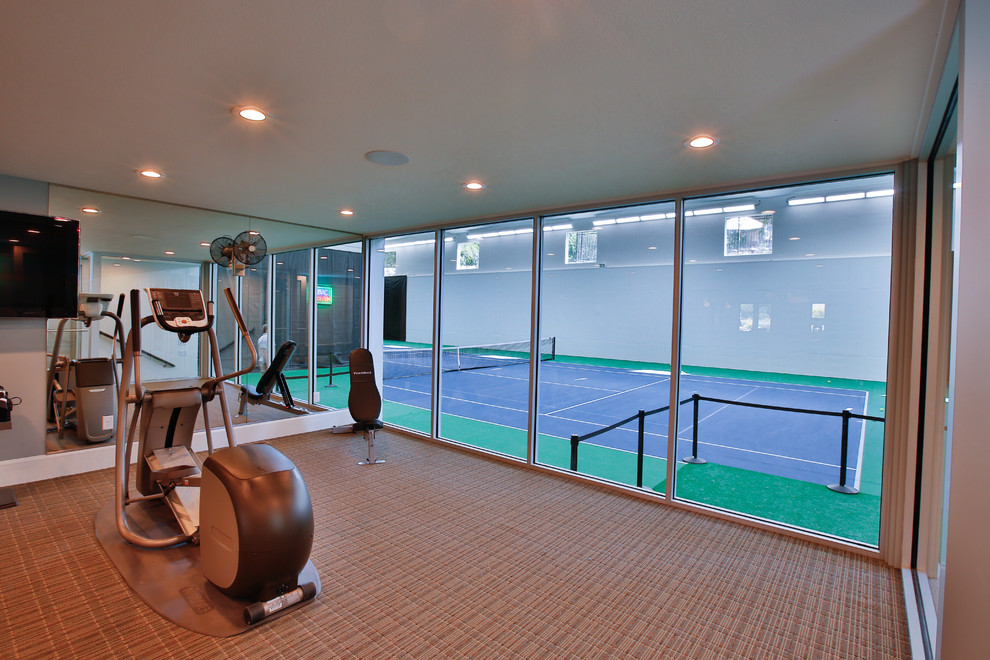 This is an example of a large traditional home weight room in Salt Lake City with grey walls.