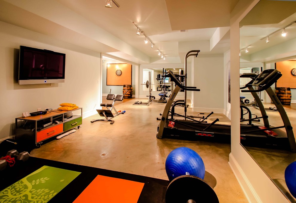 Example of a trendy concrete floor and orange floor multiuse home gym design in Atlanta
