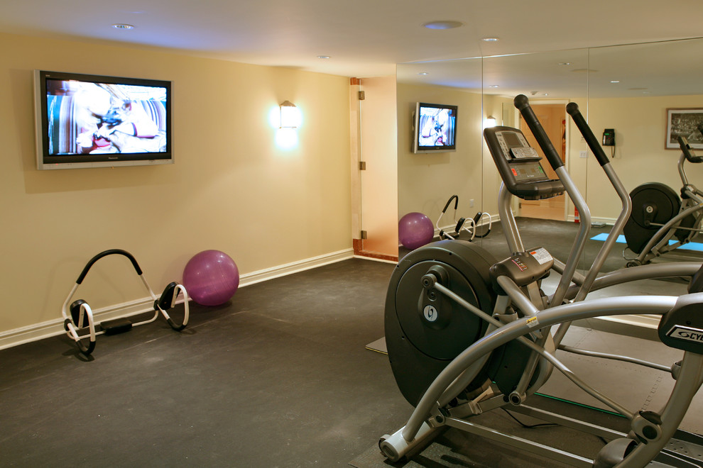 Elegant home gym photo in New York with beige walls