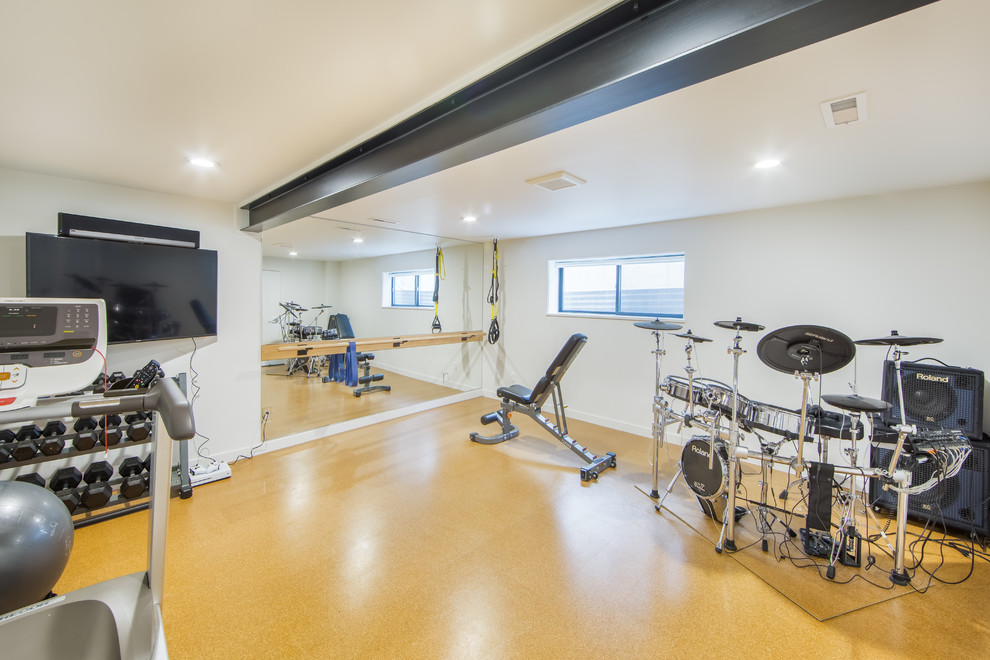 Example of a mid-century modern home gym design in Seattle