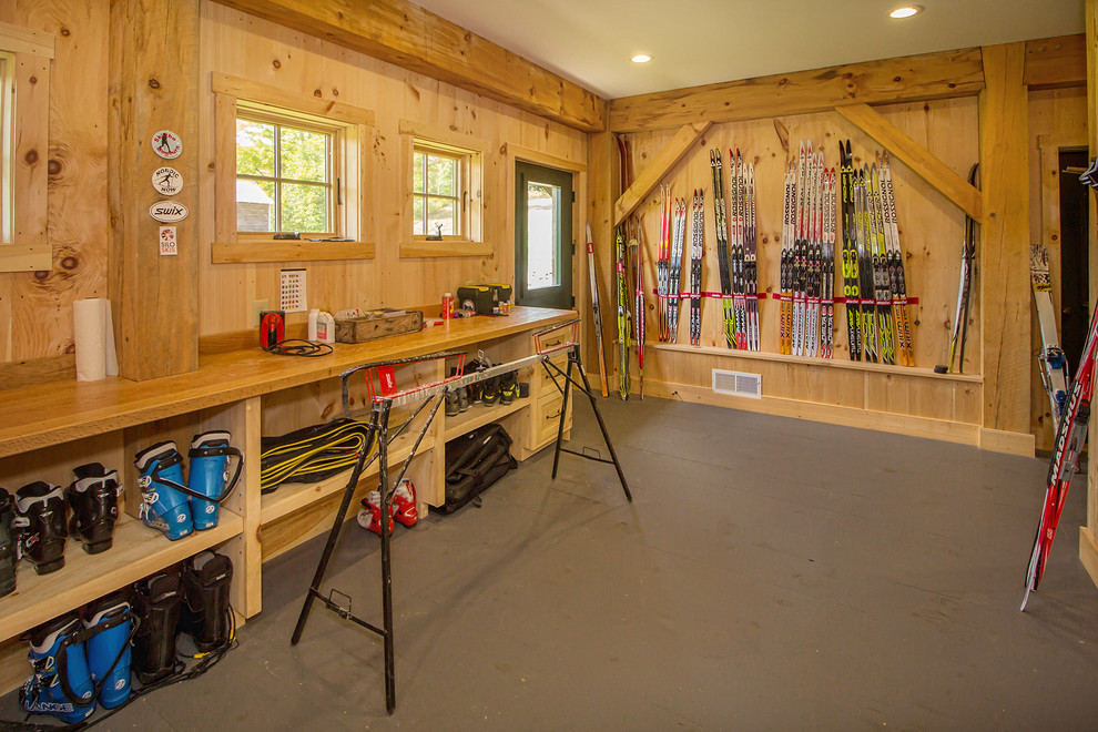 Multiuse home gym - mid-sized rustic gray floor multiuse home gym idea in Other with brown walls