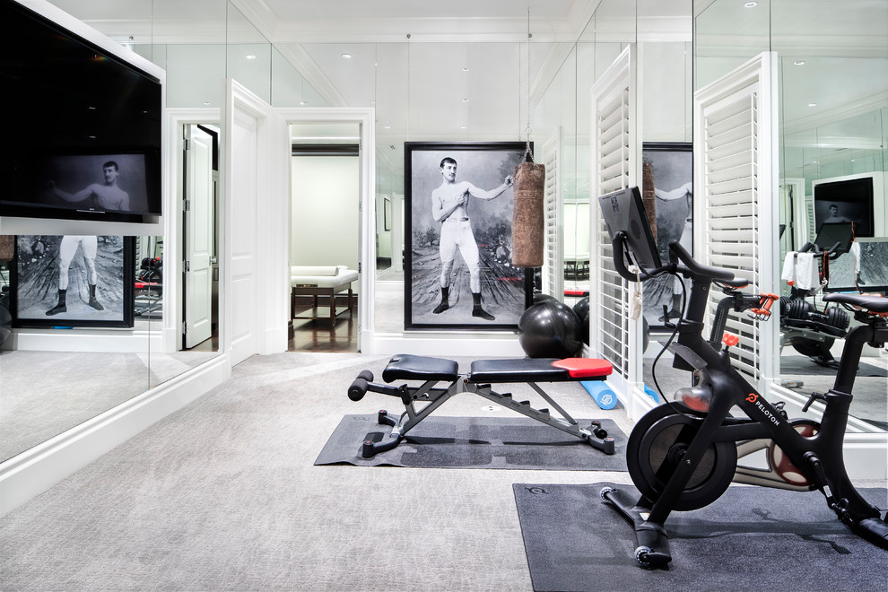Large classic home weight room in Austin with white walls, carpet and grey floors.