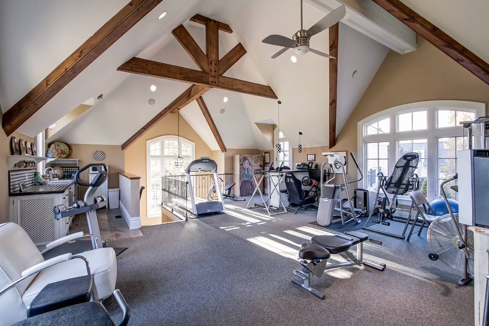 Design ideas for a traditional home gym in Nashville with beige walls and carpet.