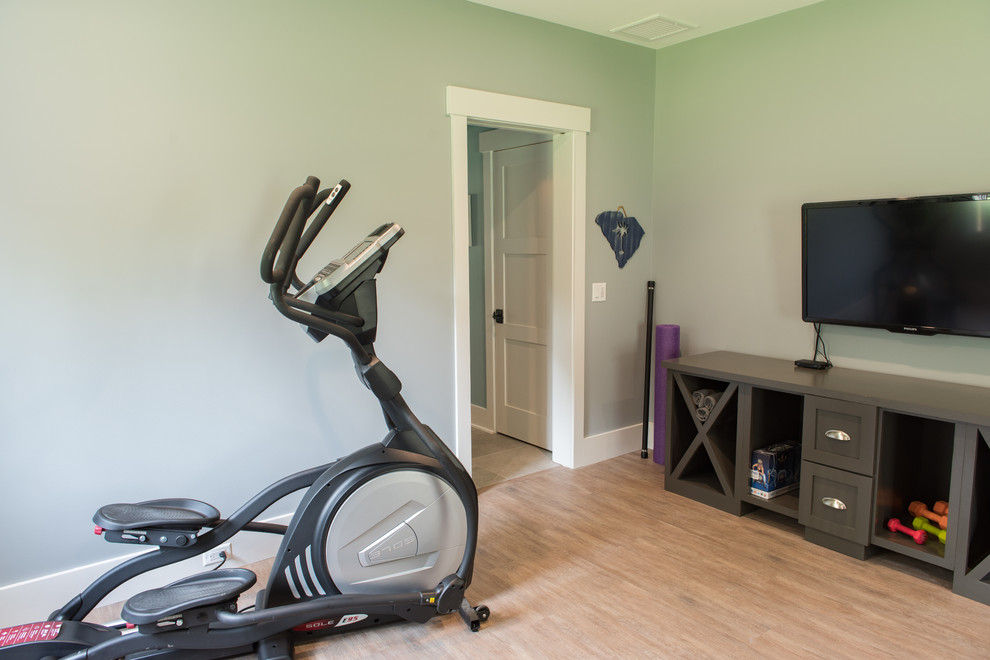 Photo of a medium sized traditional home gym in Charleston with grey walls, vinyl flooring and brown floors.