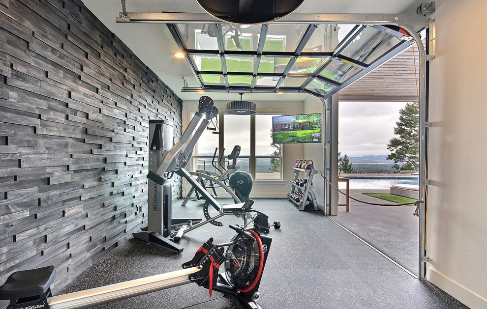 Large rural home weight room in Portland with brown walls, multi-coloured floors and a feature wall.