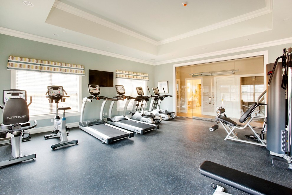 This is an example of a large contemporary multi-use home gym in New York with green walls.