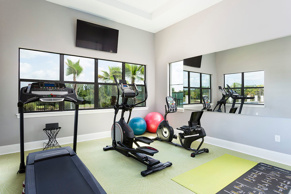 Multiuse home gym - mid-sized transitional cork floor and green floor multiuse home gym idea in Orlando with gray walls