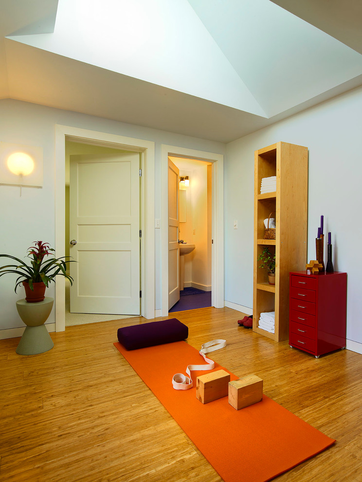 Photo of a classic home yoga studio in Detroit with bamboo flooring.