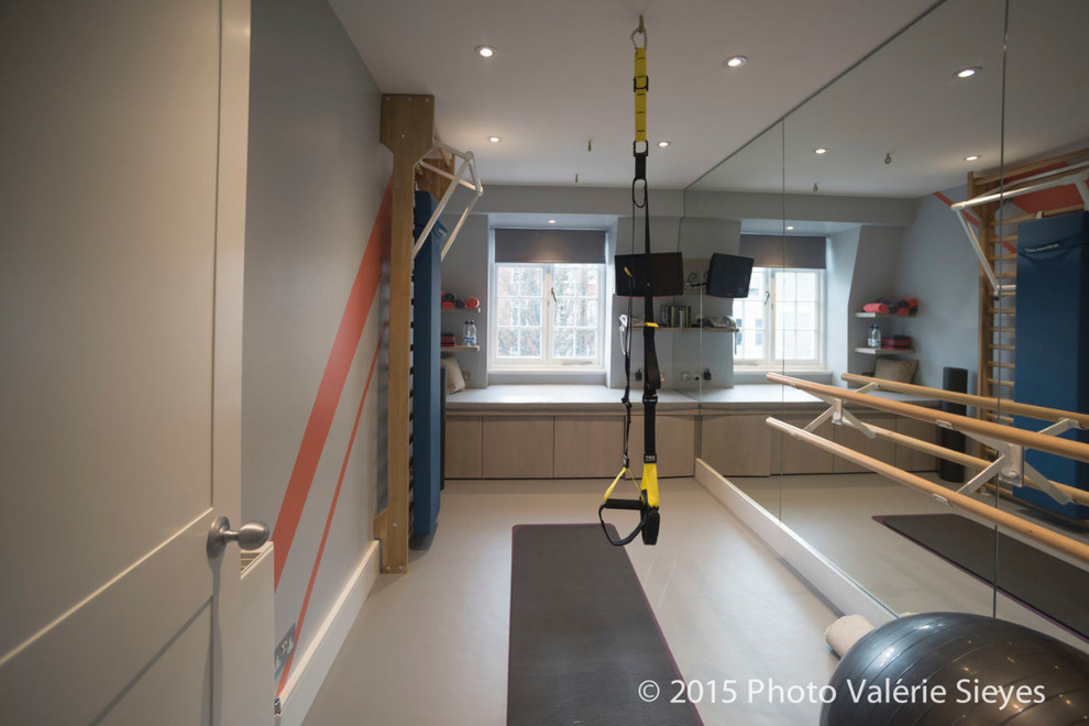 Design ideas for a contemporary home gym in London with grey walls.