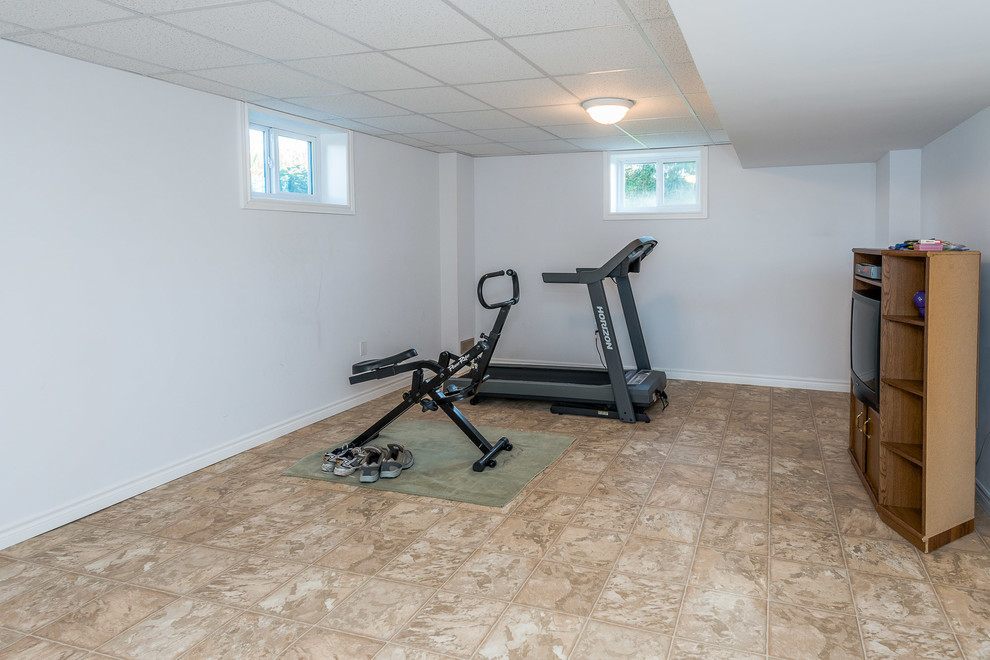 Large cottage linoleum floor multiuse home gym photo in Toronto with white walls
