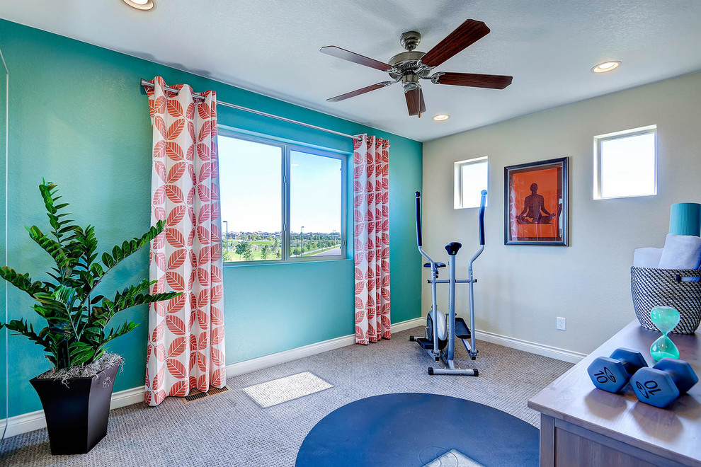 This is an example of a traditional multi-use home gym in Denver with blue walls, carpet and a feature wall.