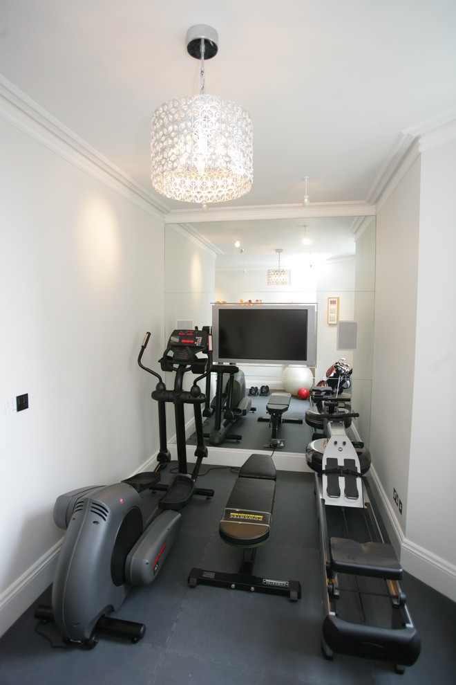 Photo of a small classic multi-use home gym in London with white walls and feature lighting.