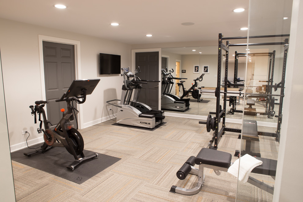 This is an example of a medium sized traditional multi-use home gym in Chicago with beige walls, carpet and multi-coloured floors.