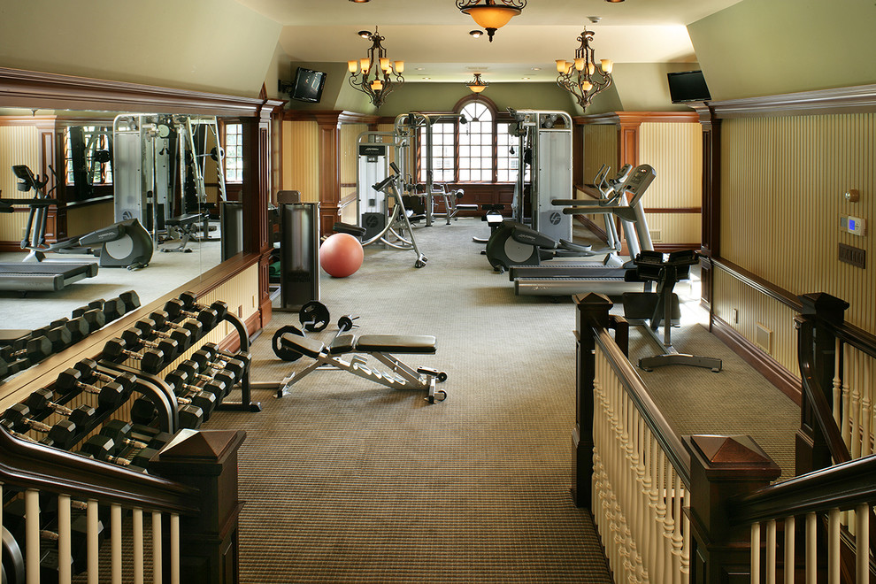 Photo of a traditional home gym in New York with green walls.