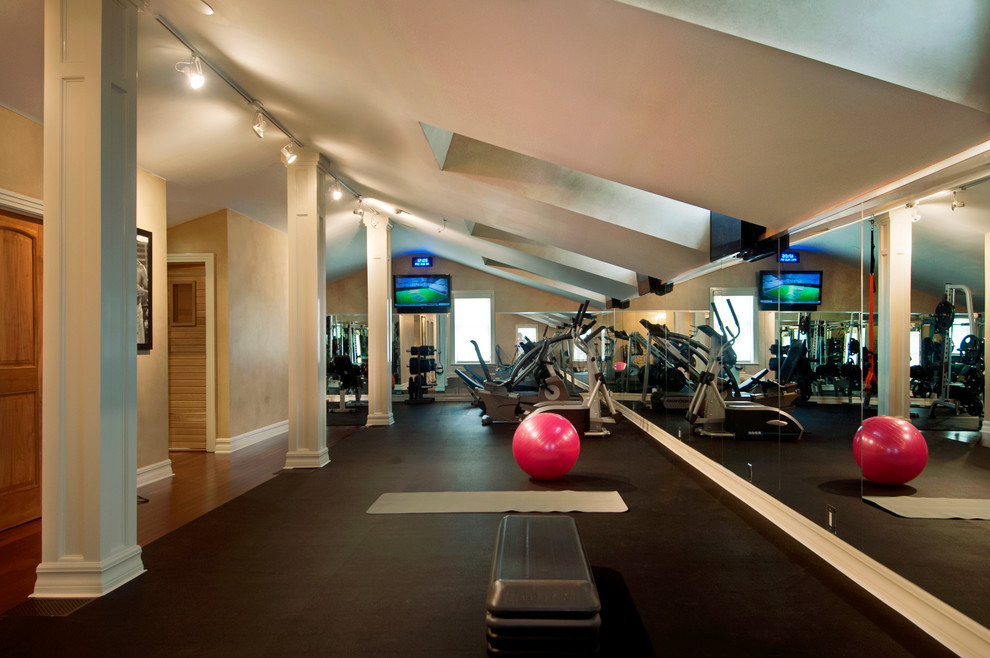 Home weight room - large traditional home weight room idea in Tampa with beige walls