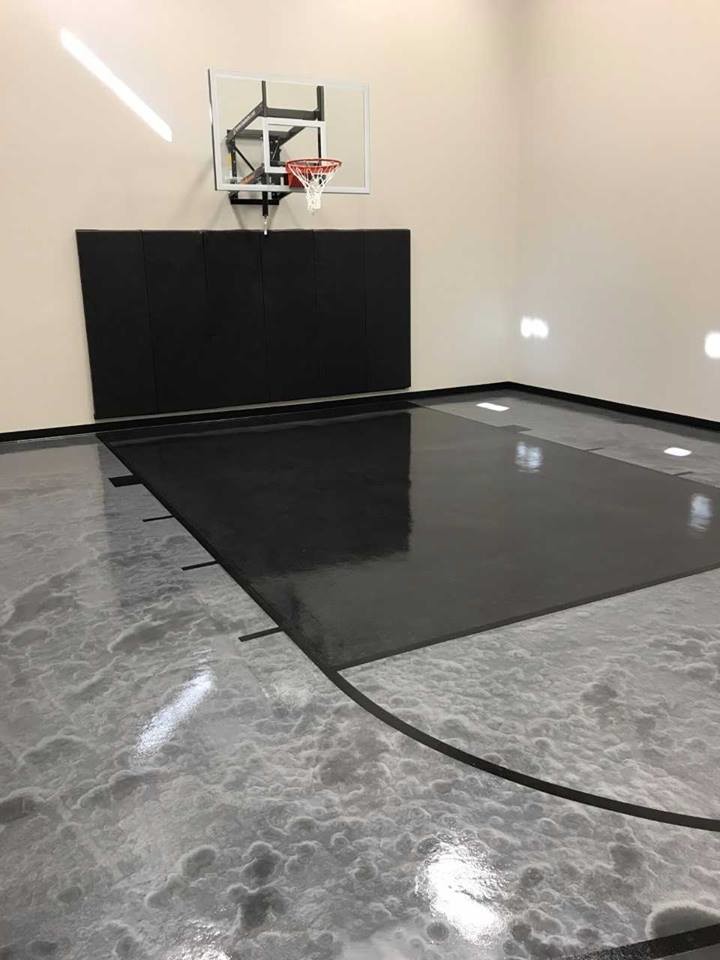 Traditional indoor sports court in Other with grey floors.