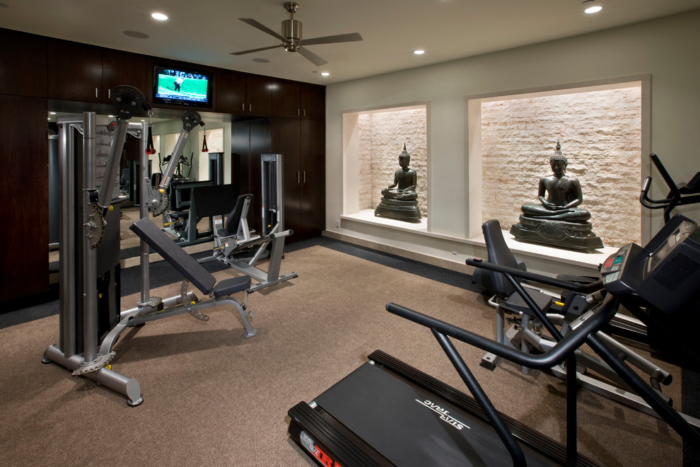 Example of a trendy carpeted and beige floor home weight room design in Los Angeles with beige walls