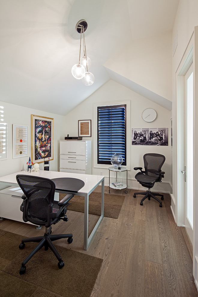 Inspiration for a contemporary home office remodel in Toronto with white walls