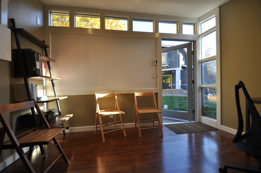 Huge minimalist freestanding desk home office photo in San Francisco with beige walls