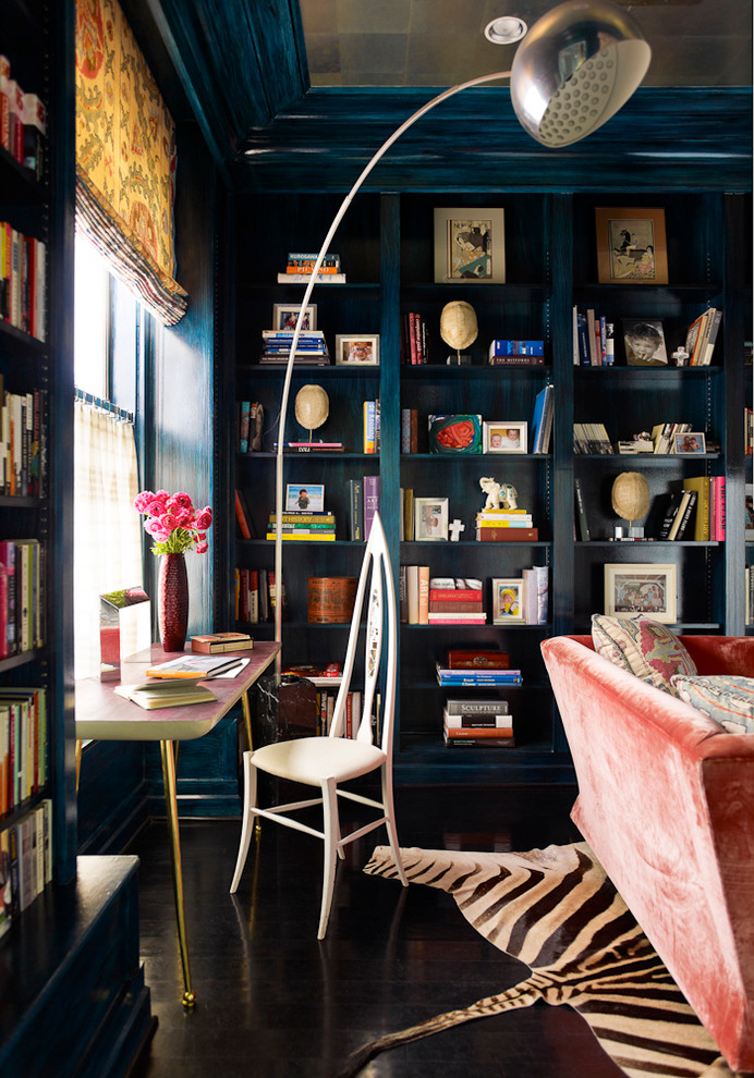 Example of an eclectic black floor home office library design in San Francisco