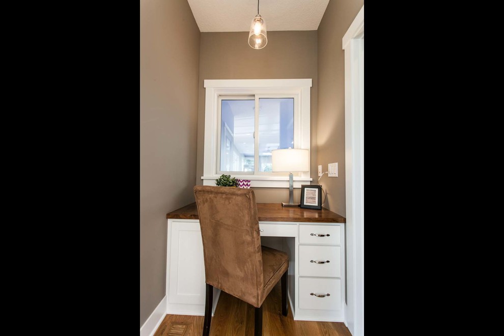 Inspiration for a small built-in desk carpeted home office remodel in Minneapolis with no fireplace