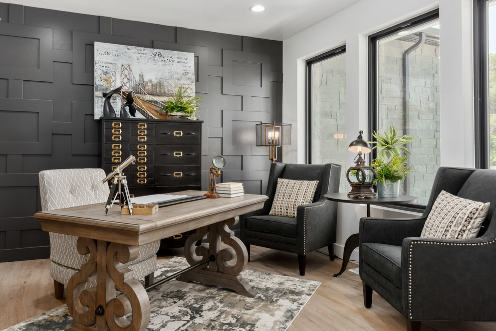 Home office - transitional freestanding desk light wood floor and beige floor home office idea in Salt Lake City with white walls
