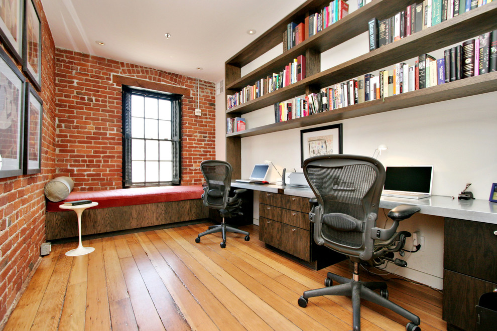 Home office - industrial built-in desk home office idea in San Francisco