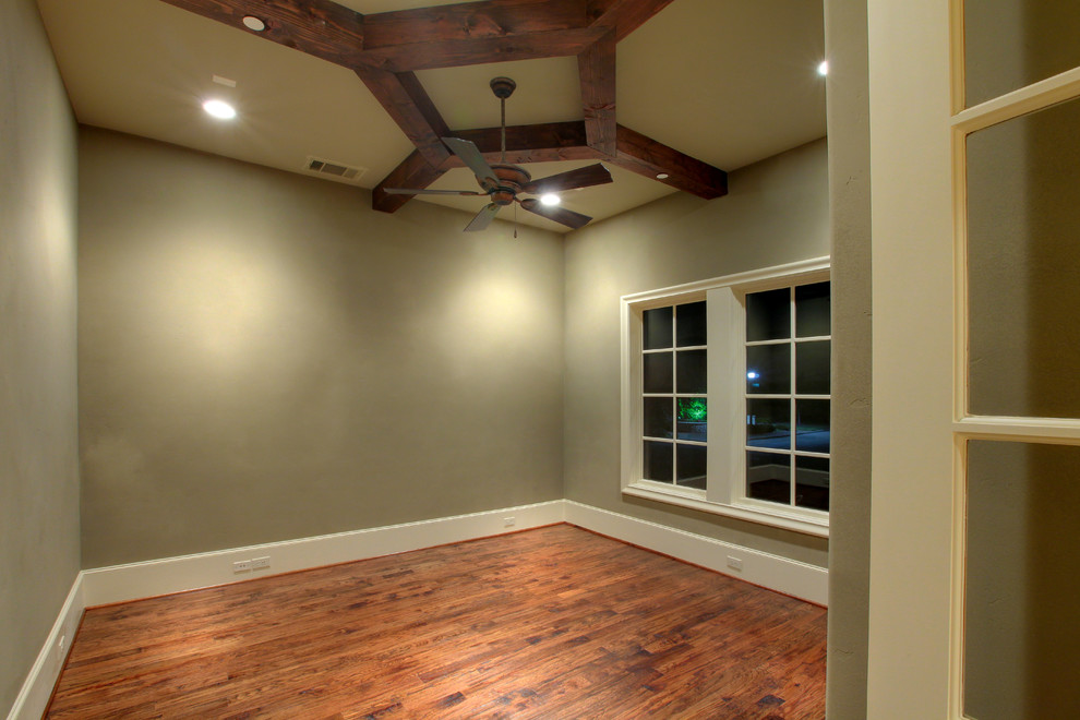 Tuscan medium tone wood floor study room photo in Dallas with green walls