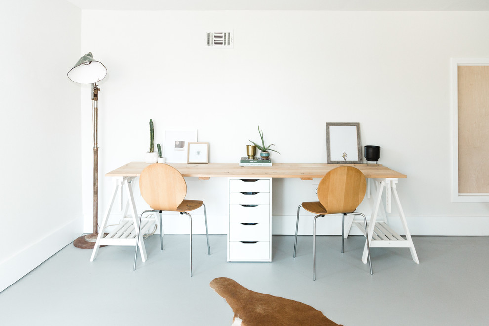 Inspiration for a coastal freestanding desk gray floor home office remodel in San Diego with white walls