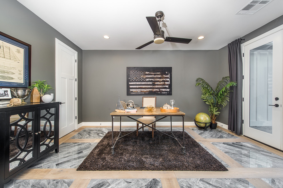 Photo of a large traditional home office in Phoenix with grey walls, marble flooring, no fireplace and a freestanding desk.