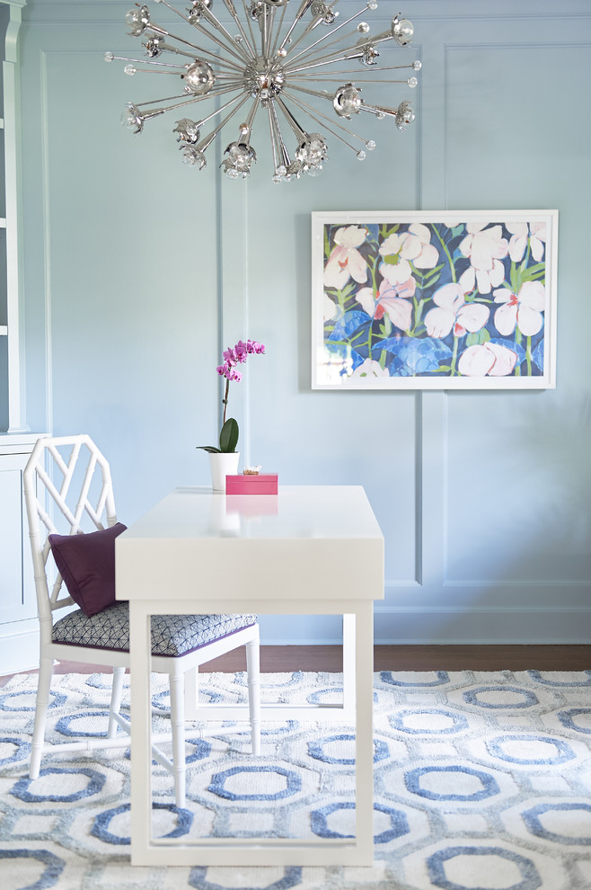 Inspiration for a mid-sized transitional dark wood floor and brown floor home office library remodel in New York with blue walls