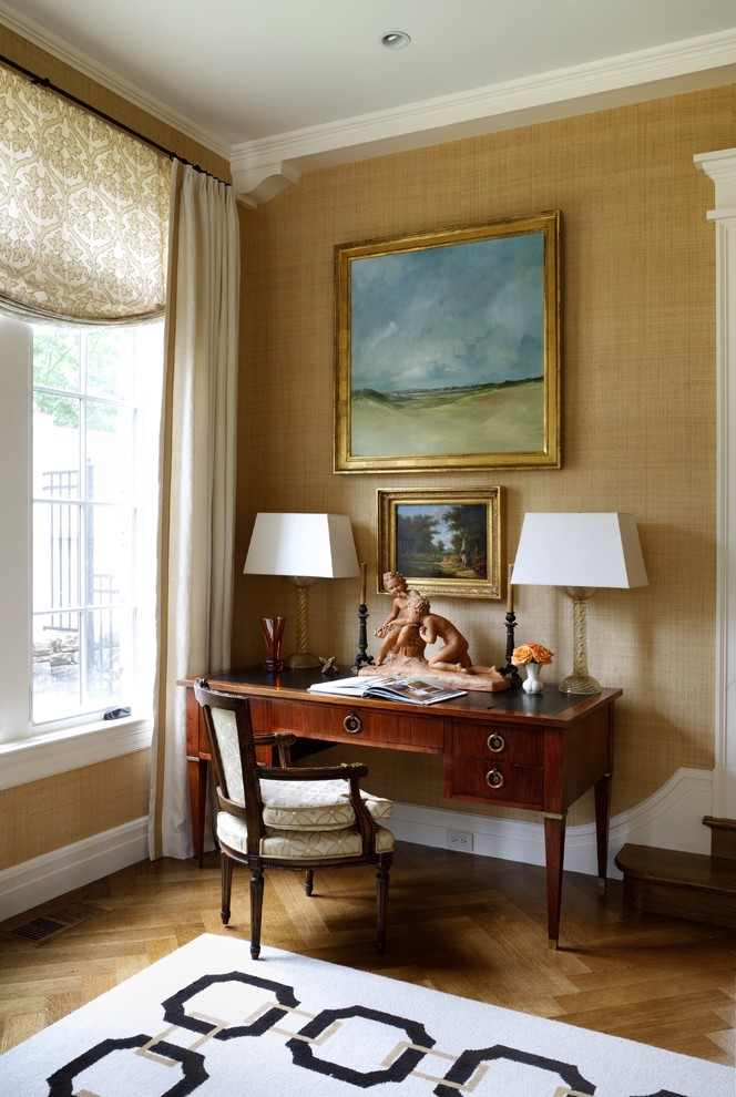 Elegant freestanding desk medium tone wood floor home office photo in DC Metro