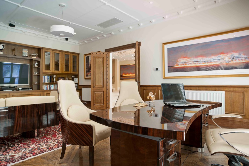 Large elegant freestanding desk medium tone wood floor study room photo in Melbourne with white walls