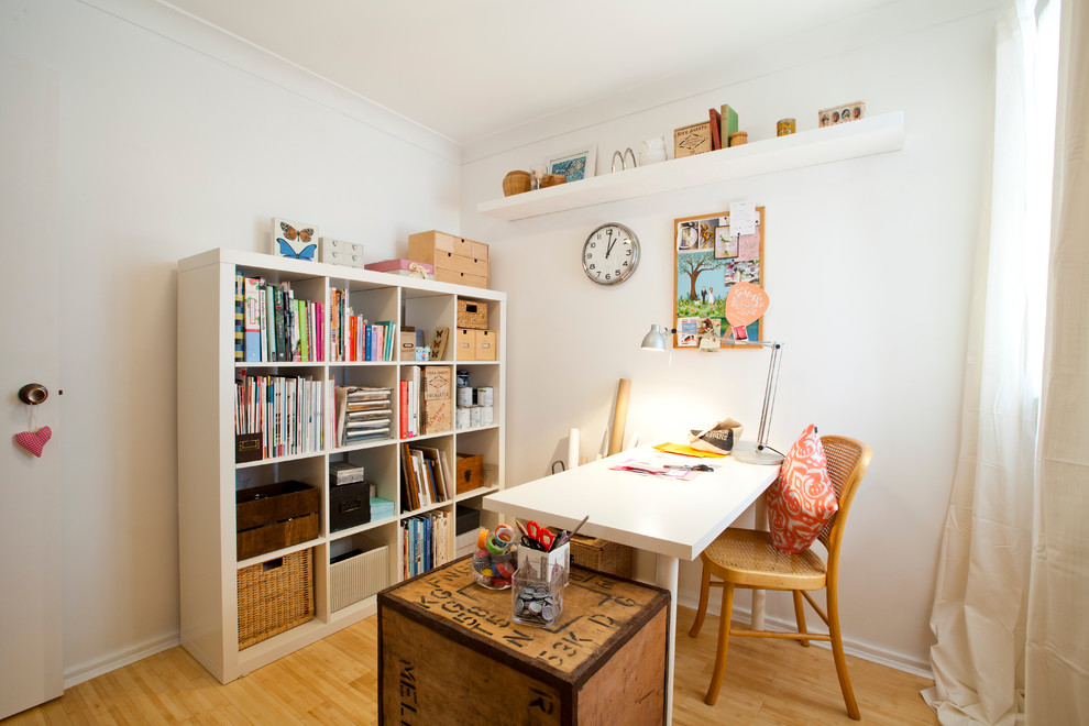 Inspiration for a small eclectic freestanding desk light wood floor craft room remodel in Perth with white walls