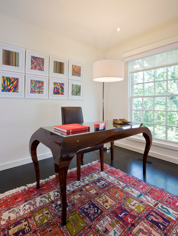 This is an example of a contemporary home office in DC Metro with white walls, dark hardwood flooring and a freestanding desk.