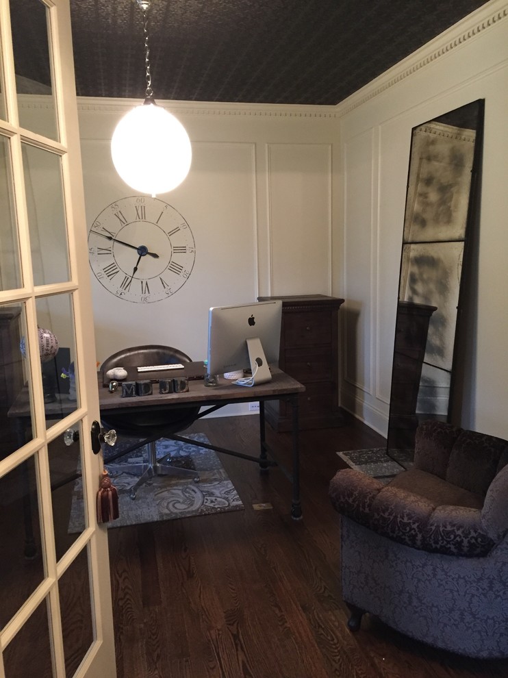 Medium sized traditional study in Chicago with medium hardwood flooring, no fireplace and a freestanding desk.