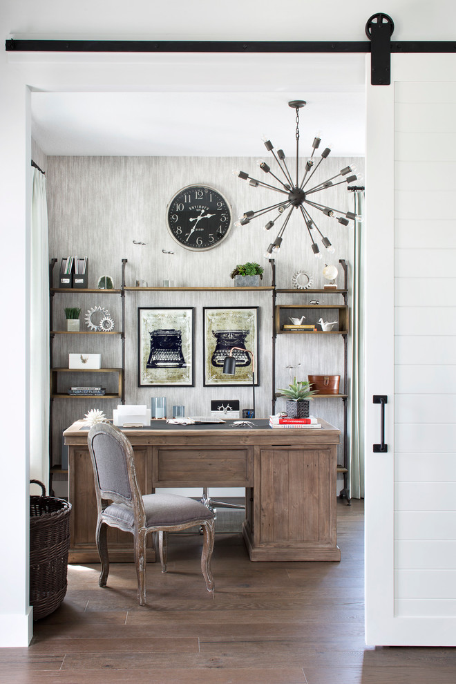 Study room - transitional freestanding desk medium tone wood floor and brown floor study room idea in Miami with green walls