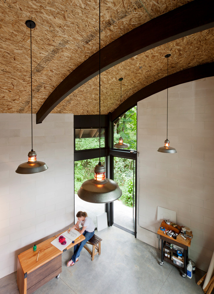 Urban home office in Seattle with concrete flooring.